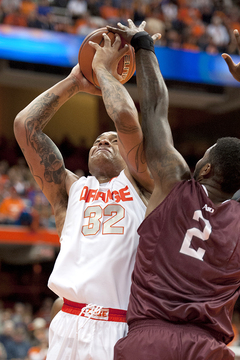 DaJuan Coleman struggles to get a shot up in the paint.