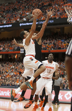 Tyler Ennis attempts a contested layup.