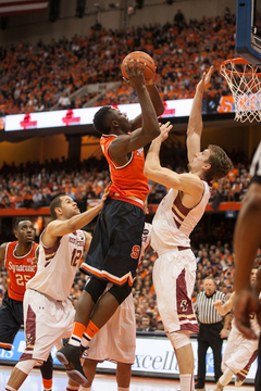 Grant jumps to the rim in a crowded paint. 