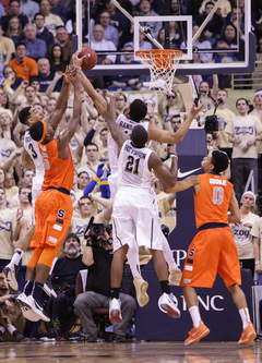 Fair, Randall and Cameron Wright fight for a loose ball in the waning minutes of the game. 