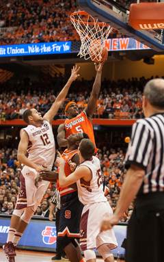 C.J. Fair goes up with his left hand in traffic. 