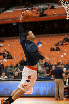 DeRemer goes up for a left-handed dunk in warmups. 