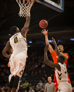 Syracuse junior forward Michael Gbinije tries a floater from the baseline. 