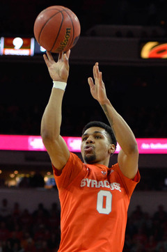 Gbinije rises for a jump shot. He went 4-of-13 from the field on Saturday.