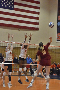 Christina Oyawale and Mariia Levanova jump up to block a Boston College shot. SU had 10 blocks.