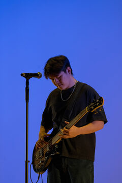 One student showcases his musical talent by playing his guitar on stage at the event. The gala provided students with a platform to dance, perform songs or play musical instruments of their choice. 