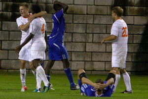 Syracuse players celebrate the Orange's 1-0 win over Seton Hall on Saturday night at SU Soccer Stadium. Syracuse won its Big East opener with a solid defensive late in the game to stave off an aggressive Pirates offense. 