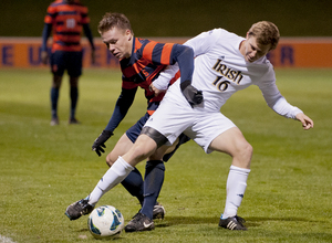 Syracuse midfielder Jordan Vale fights for the ball against Notre Dame's Kyle Richard in the Orange's 4-2 loss to the Fighting Irish in the quarterfinals of the Big East tournament. 