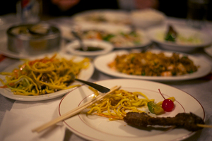 Various Chinese- and Szechuan-style dishes clutter the dining table at China Road. The restaurant offered authentic tasting cuisine.