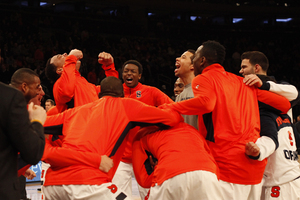 Syracuse huddles before its Big East tournament opening victory against Seton Hall. The Orange now faces Pittsburgh Thursday at 2 p.m., looking to avenge a loss while shorthanded from earlier in the season.