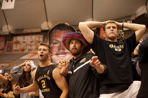 (From right to left) Alex Damore, Andrew Barrett, and Kris Proule, seniors from Bryant University, watch on, anxiously, as Syracuse comes back from a 4-0 deficit to beat the Bulldogs in the first round of the NCAA tournament.