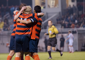 Emil Ekblom celebrates with his teammates after scoring a goal. Ekblom completed a hat trick on Friday night, leading Syracuse to a 5-0 win over NC State. 