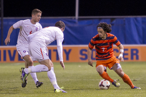 Midfielder Alex Halis knives through No. 19 Clemson's defense during Syracuse's upset victory.