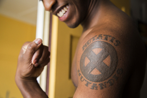 Malcolm Whitfield, a junior art photography major, shares this X-Men logo tattoo with his twin. The tattoo is a daily reminder of his brother, who serves in the Air Force.