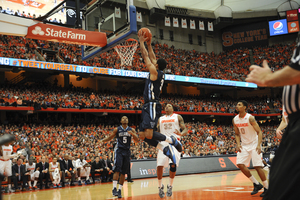 James Bell soars for a dunk for Villanova. Bell scored a game-high 25 points, including a flurry of early 3-pointers, but it was not enough as Syracuse stormed back to beat the Wildcats on Saturday.