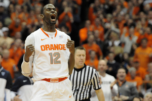 Baye Moussa Keita lets out a roar during Syracuse's comeback victory against Villanova on Saturday. Keita provided sharp interior defense and a spark of energy for the Orange, who reeled off a 20-0 first-half run.