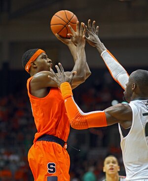 C.J. Fair rises up in No. 2 Syracuse's 64-52 win over Miami (Fla.) on Saturday. The senior finished with 15 points, seven rebounds and three assists. 