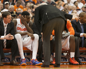 Rakeem Christmas sits on the  bench as Jim Boeheim gives him instructions. Christmas struggled defensively against Notre Dame's Garrick Sherman in No. 1 Syracuse's 61-55 win. 