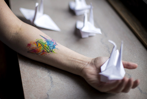 Kai Troge,  a freshman biotechnology major at SUNY-ESF, got his first tattoo with an origami crane inked onto his arm where he was struck by a car while riding a bicycle. 