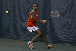 Rhiann Newborn readies herself to hit a backhand. The freshman helped Syracuse to its first win of the season by winning a pivotal singles match. 