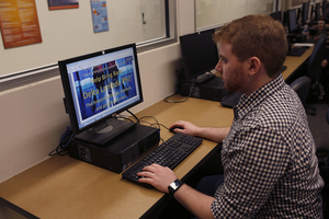 Aaron Goldsmith, a junior information technology major, designs promotional materials for Delta Lambda Phi. Goldsmith hopes to recolonize DLP, a gay, bisexual and progressive male fraternity, which was originally founded at SU in 2003. 