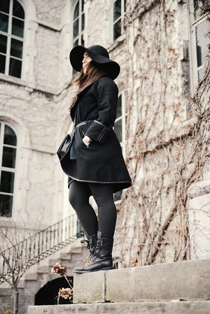 Talya Sever wears a Master GMT II Rolex watch paired with Chanel boots to show off her street style.