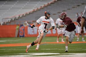 Senior attack Derek Maltz dodges down the right alley while a Colgate defender shadows him. Maltz, along with SU's eight other seniors, were honored before the Orange's 19-6 win. 