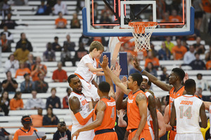 Rakeem Christmas lifts up Nick Trivelpeice, a 10-year old who has connected with the SU basketball team through a program that joins children with brain tumors with high school and college athletes. Trivelpiece entered the game at the end of the scrimmage and made a layup at Orange Madness on Friday night. 