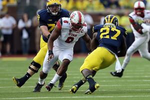 Nate Orchard (left) leads the NCAA with 16.5 sacks and comes from a background that made him grow up faster than a lot of college football players. 