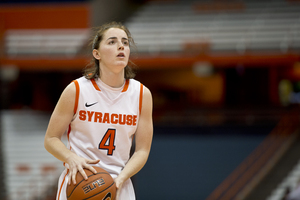 Syracuse guard Maggie Morrison looks at the rim as she holds the ball during the Orange's 94-63 win Monday night. She set a career-high with 11 points on the night.