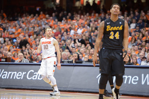 Trevor Cooney smirks as his 40-foot buzzer-beater falls to close out the first half. He had 14 points in the first 20 minutes of Syracuse's 18-point win.