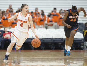 SU guard Maggie Morrison dribbles upcourt while Virginia's Aliyah Huland El trails behind.