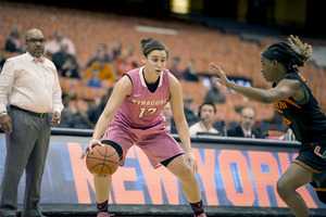 Brianna Butler dribbles around the perimeter. She scored 19 points for Syracuse, but it wasn't enough for the Orange to overcome Miami on Thursday. 