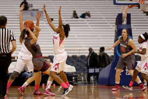 Two Syracuse players pressure a BC ball-handler on Thursday night. The Orange forced 30 turnovers in a 73-51 win in the Carrier Dome.