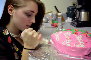 Katherine Guerin learned the art of baking at a cake decorating class. Most of her orders are wedding cakes, which she calls high-pressured due to high expectations.