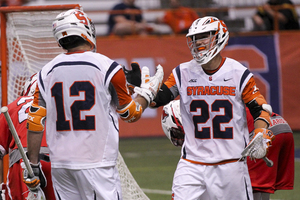 Jordan Evans (22) celebrates with Derek DeJoe after scoring a goal. He had five on the night, a career-high. 