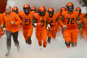 Syracuse jogs onto the field at the start of its 30-17 win over Wake Forest in the Carrier Dome on Saturday. 