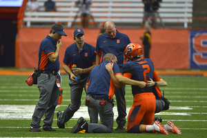 Eric Dungey left Saturday's game against Central Michigan in the second quarter after being hit near his head by defensive lineman Mitch Stanitzek.