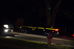 A New York State Trooper on Comstock Avenue, where suspects were believed to be running from police in Oakwood Cemetery near the Syracuse University campus. 