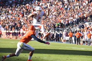 Eric Dungey leapt over a defender for a touchdown in the second quarter, but Syracuse couldn't out-punch Virginia in a 44-38 triple-overtime loss on Saturday. 