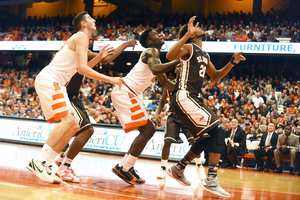 Tyler Roberson (21) looks up at the basket hoping to corral a rebound in SU's win over St. Bonaventure.