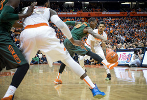 Michael Gbinije and Syracuse lost to No. 13 Miami in Coral Gables, Florida, 64-51.