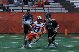 Dylan Donahue looks to move past an Army defender in the first half of Syracuse's 9-8 win over the Black Knights on Sunday. Donahue was held to a season-low two points in the victory. 