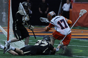 Syracuse's Dylan Donahue stumbles in front of the Army goal during the Orange's 9-8 win over the Black Knights on Sunday. The senior attack finished with a season-low two points. 