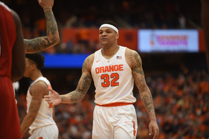 Dajuan Coleman scored seven points and grabbed seven rebounds, and he helped keep Syracuse even on the boards with North Carolina State. 