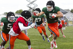 Juwan Dowels (red jersey) has a chance to be Syracuse's starting nickel cornerback this fall. He'll be competing for the job with Wayne Morgan and Christopher Fredrick.