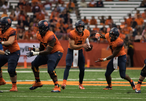 Eric Dungey went 34-for-40 in Syracuse's 33-7 win over Colgate on Friday night. Hours after meeting his brother for the first time in two years, Dungey had a career game.