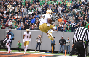 DeShone Kizer celebrates a touchdown run against Syracuse on Saturday. He threw for 465 yards against the Orange.