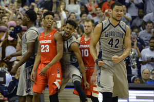 Georgetown center Bradley Hayes (42) had his way inside with Syracuse last year, scoring 21 points and picking up eight rebounds. The Orange will look to keep him from repeating that same performance this year. 