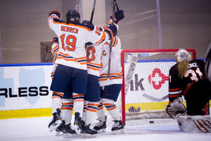 Syracuse players celebrate next to the RIT goal right after scoring. The Orange thoroughly dominated the game, outshooting the Tigers 42-13 in the 4-0 victory. 